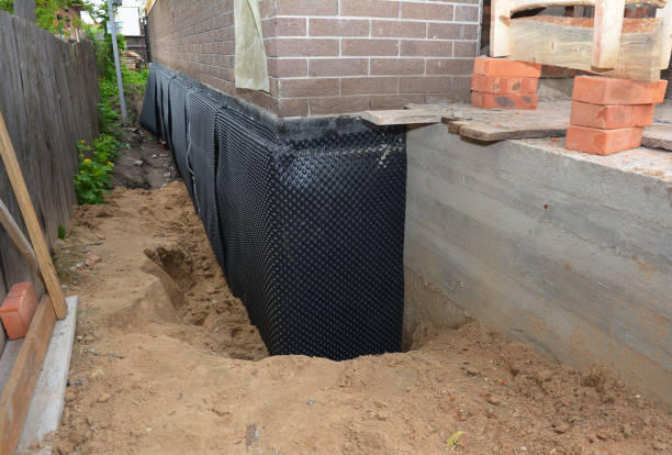 Happy homeowners after waterproofing job in Boggstown